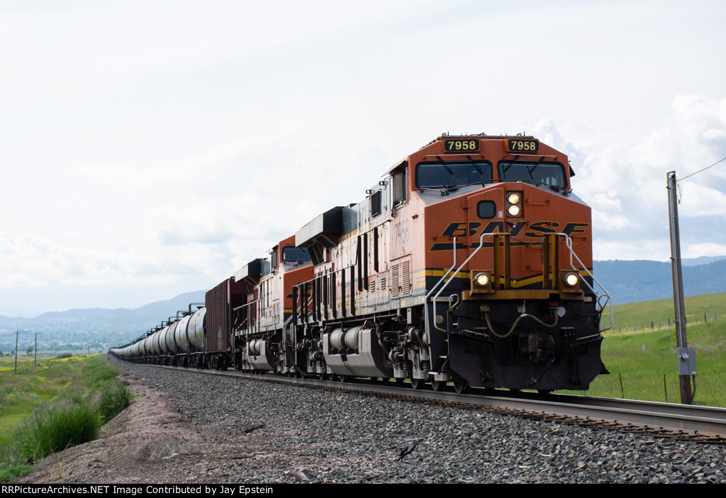 BNSF 7958 leads a tank train west a Birdseye Road